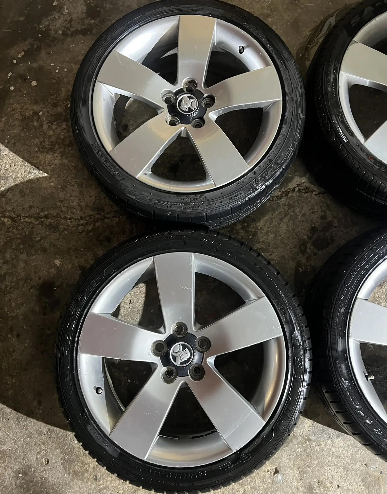 Basic 5-spoke factory wheels before budget restoration