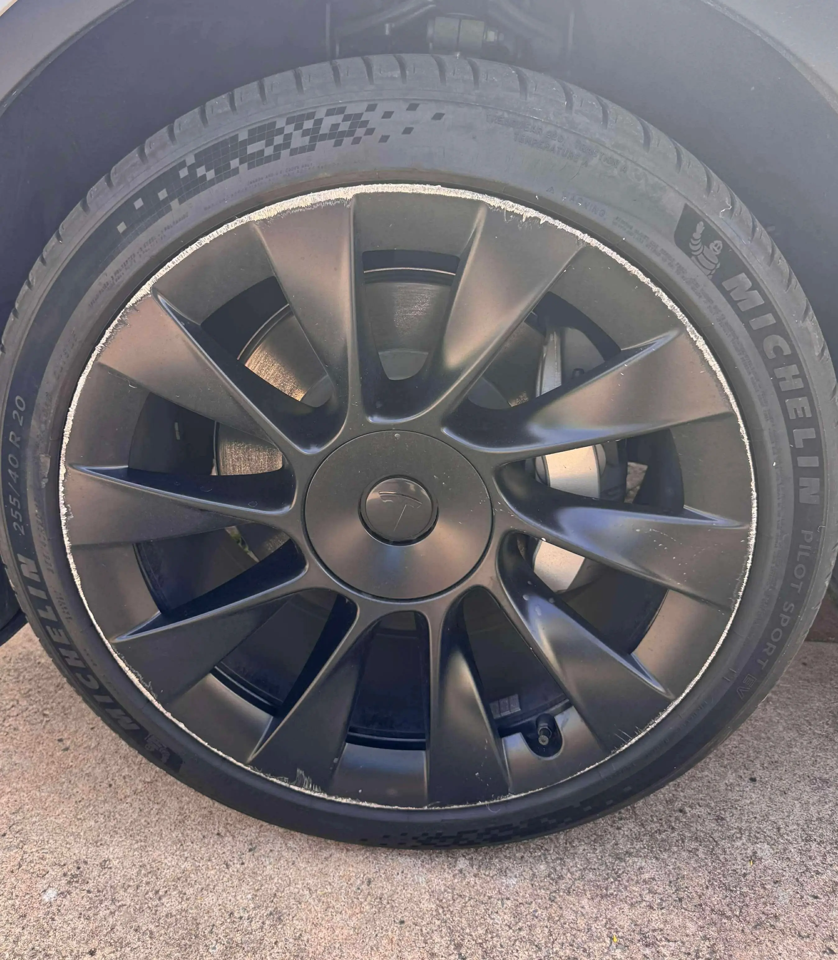 Factory  Tesla sport wheels with heavy rash before professional repair in Adelaide